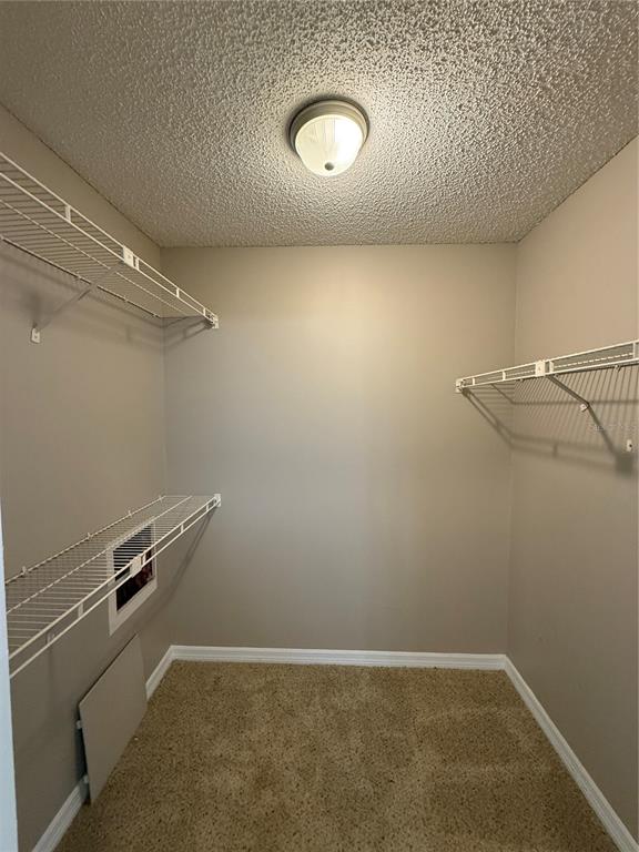 8209 Olympia Court Longwood, FL 32779 - Photo 16 of 29 a view of a room with racks on the wall