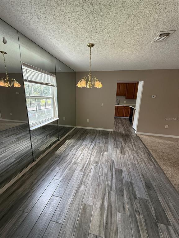 8209 Olympia Court Longwood, FL 32779 - Photo 19 of 29 wooden floor in an empty room with a window