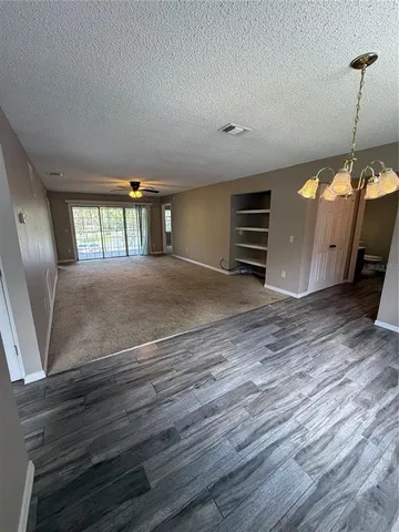 a view of a livingroom with furniture and wooden floor
