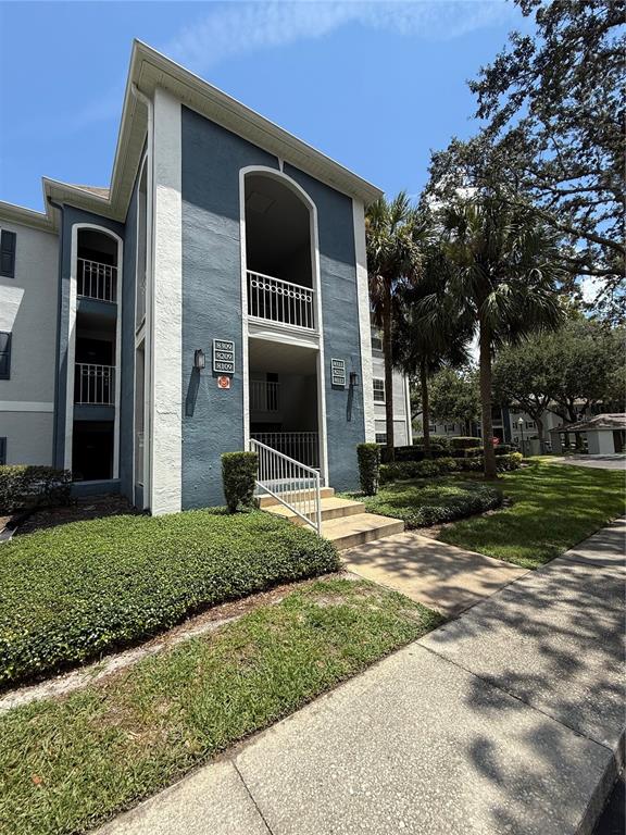 8209 Olympia Court Longwood, FL 32779 - Photo 2 of 29 a front view of a house with garden