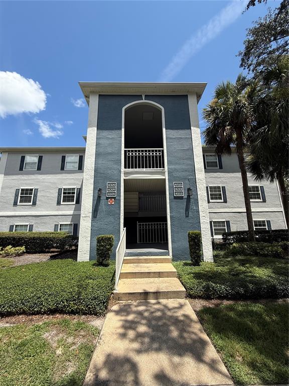 8209 Olympia Court Longwood, FL 32779 - Photo 26 of 29 a front view of a house with a yard