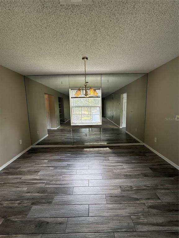8209 Olympia Court Longwood, FL 32779 - Photo 4 of 29 a view of a room with wooden floor