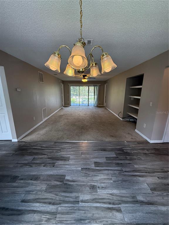 8209 Olympia Court Longwood, FL 32779 - Photo 5 of 29 a view of a living room a stove and furniture