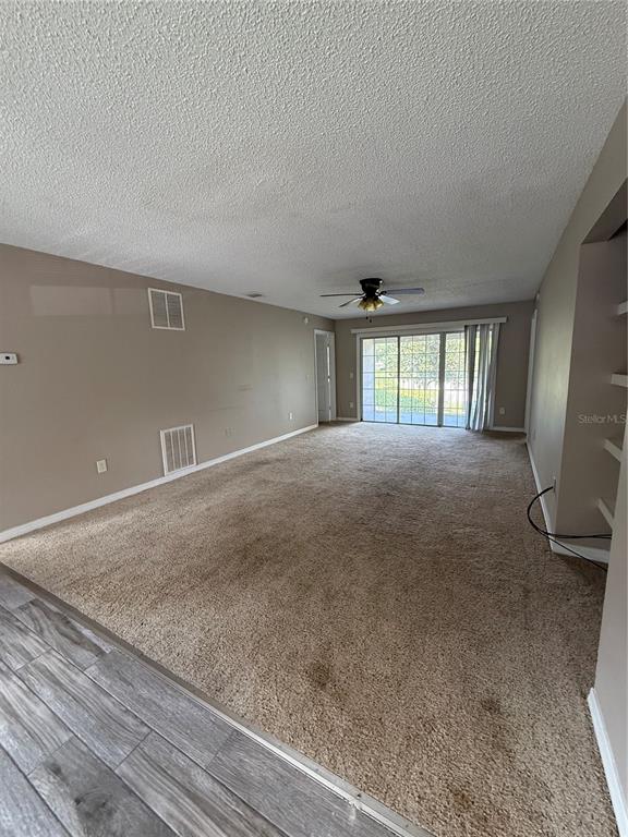 8209 Olympia Court Longwood, FL 32779 - Photo 6 of 29 a view of an empty room with glass door