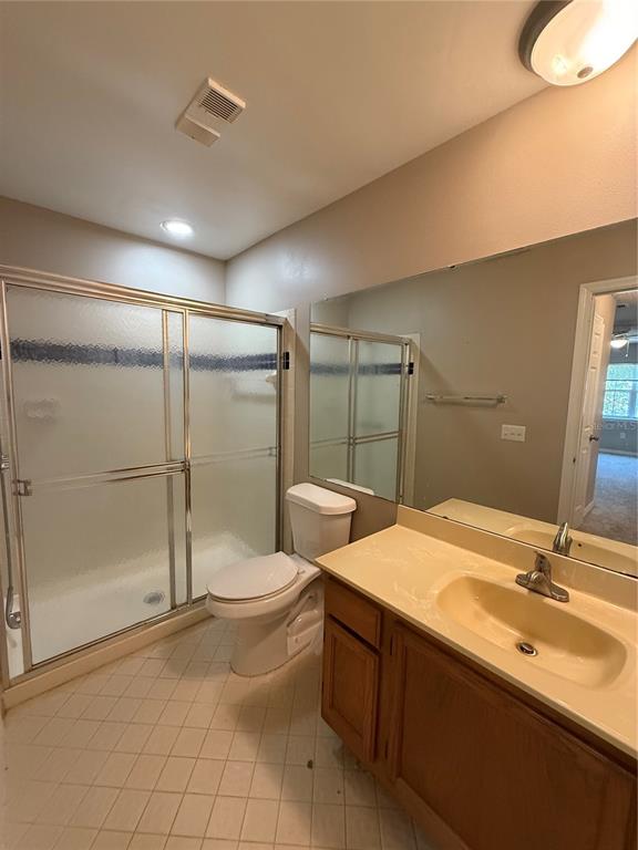 8209 Olympia Court Longwood, FL 32779 - Photo 9 of 29 a bathroom with a double vanity sink toilet and shower