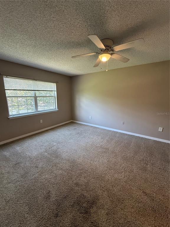8209 Olympia Court Longwood, FL 32779 - Photo 10 of 29 an empty room with a empty space and windows