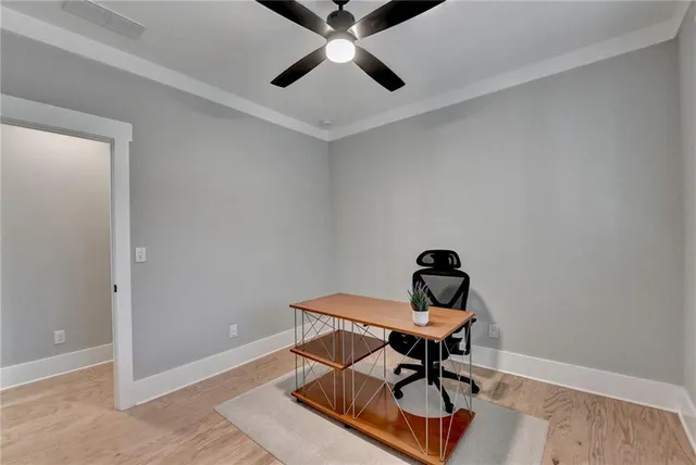 a bedroom with a bed and a table in it