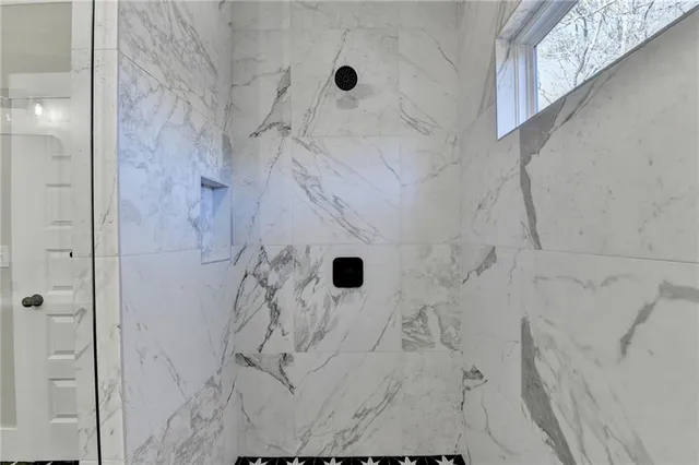 a view of empty room with a ceiling fan