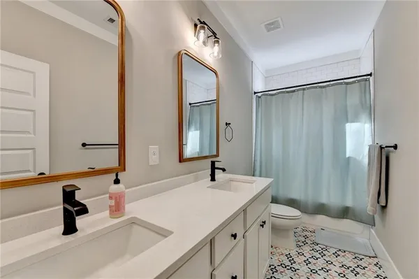a bedroom with a bed and a cabinets