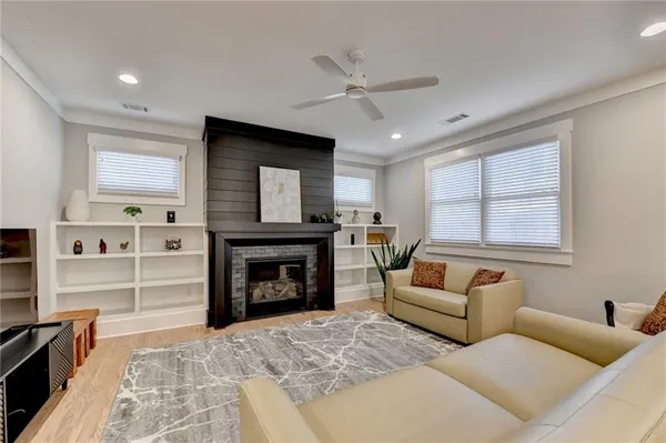 a living room with furniture and a fireplace