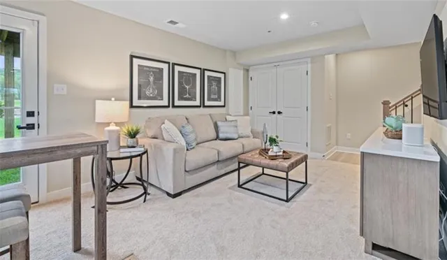 a living room with furniture and a window