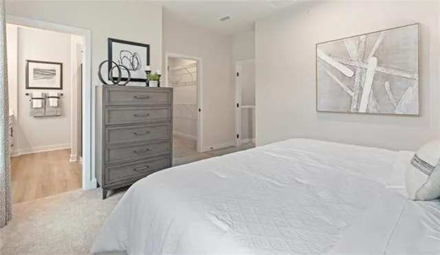 a bedroom with a bed and a mirror