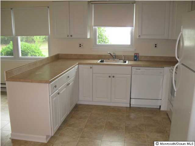 19 Patmore Road Brick, NJ 08724 - Photo 3 of 3 a kitchen with white cabinets and window