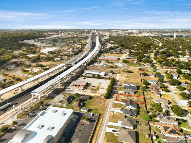 an aerial view of residential building with parking space