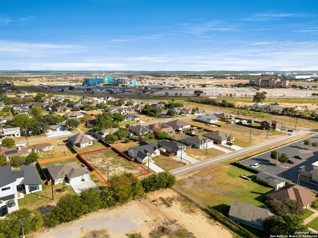 an aerial view of residential building and ocean view