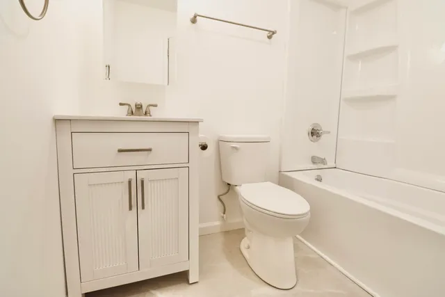 a bathroom with a shower and a toilet