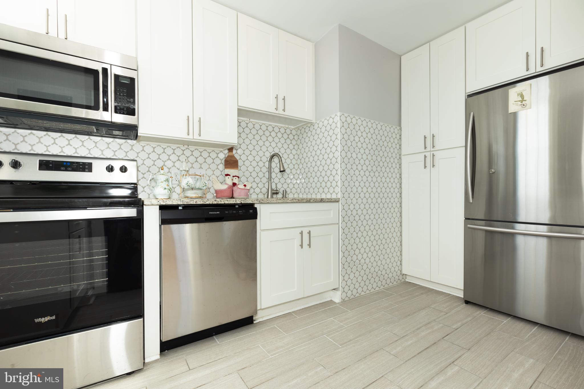 1 East Chase Street, Unit 712 Baltimore, MD 21202 - Photo 11 of 49 Sleek modern kitchen with stylish finishes.