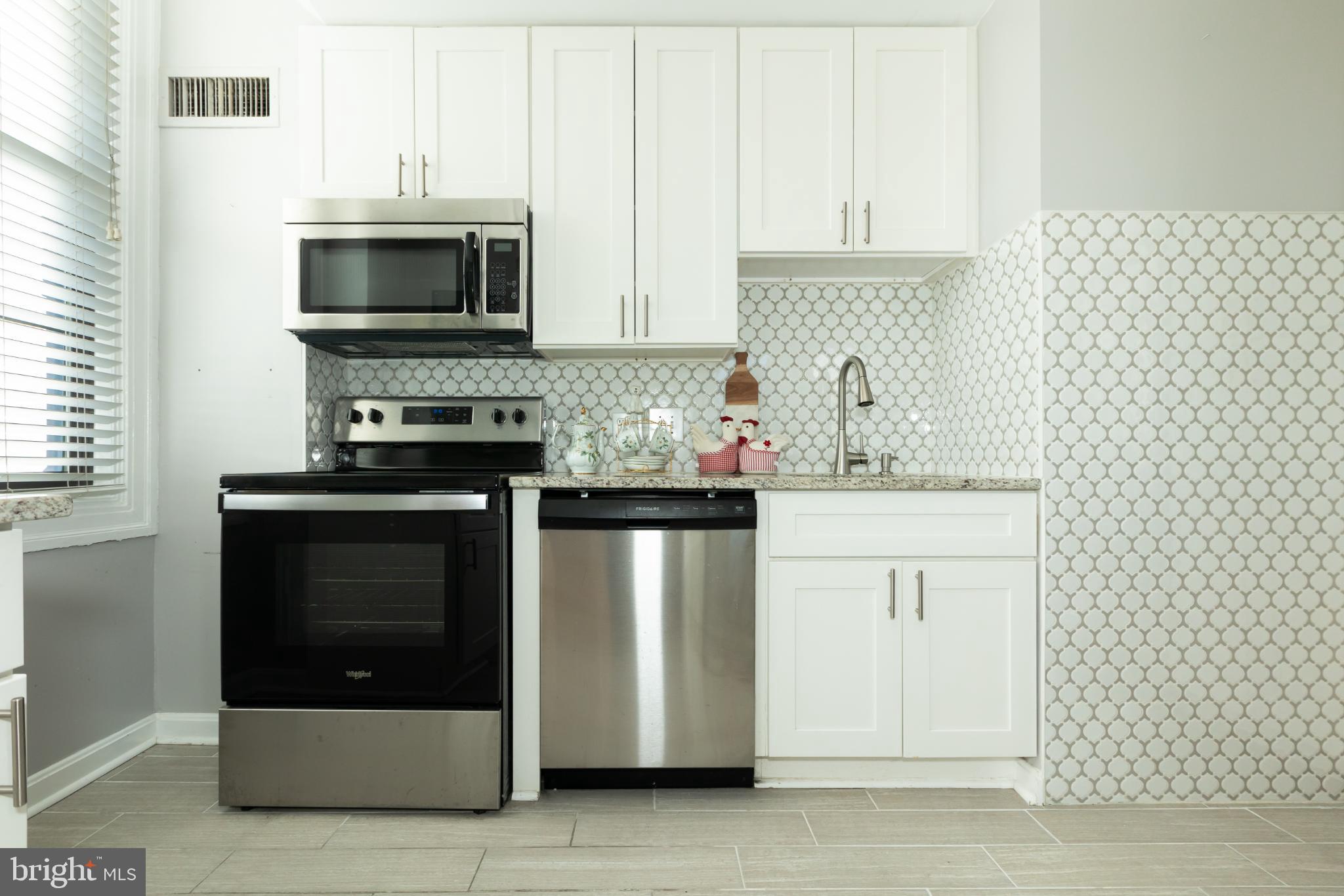 1 East Chase Street, Unit 712 Baltimore, MD 21202 - Photo 21 of 49 Modern kitchen with sleek finishes.