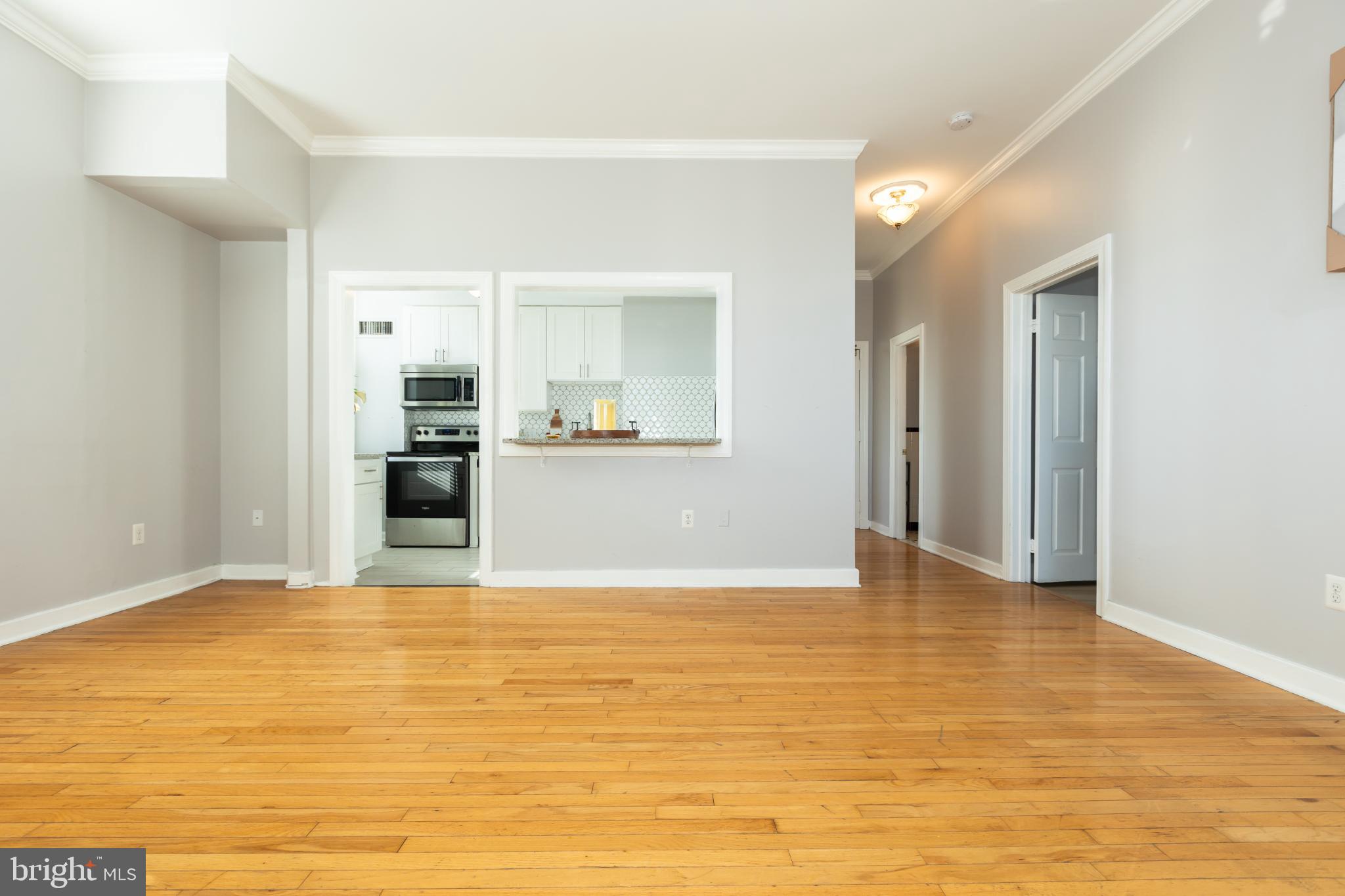 1 East Chase Street, Unit 712 Baltimore, MD 21202 - Photo 26 of 49 Spacious, sunlit living area with modern charm.