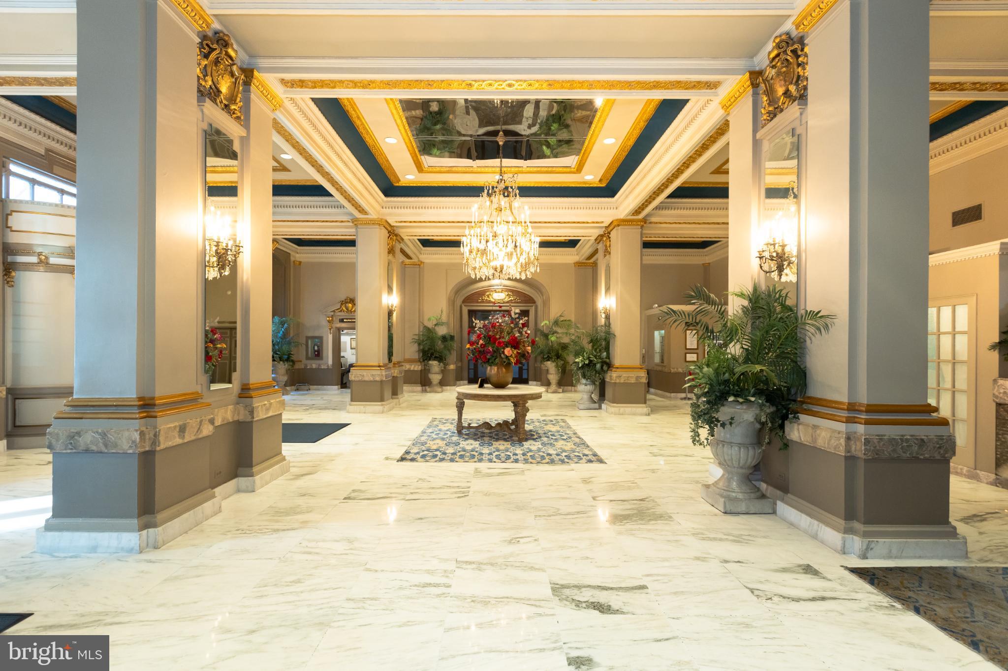 1 East Chase Street, Unit 712 Baltimore, MD 21202 - Photo 44 of 49 Elegant lobby with grand chandeliers.