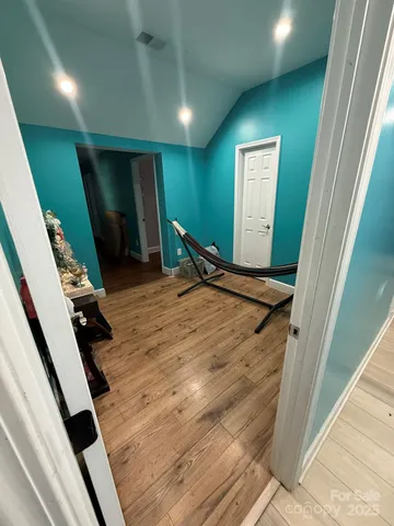 a view of entryway with wooden floor