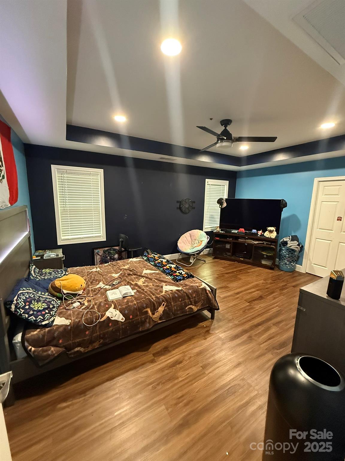 10116 Robert Bost Road Midland, NC 28107 - Photo 17 of 32 a bedroom with bed and a flat screen tv