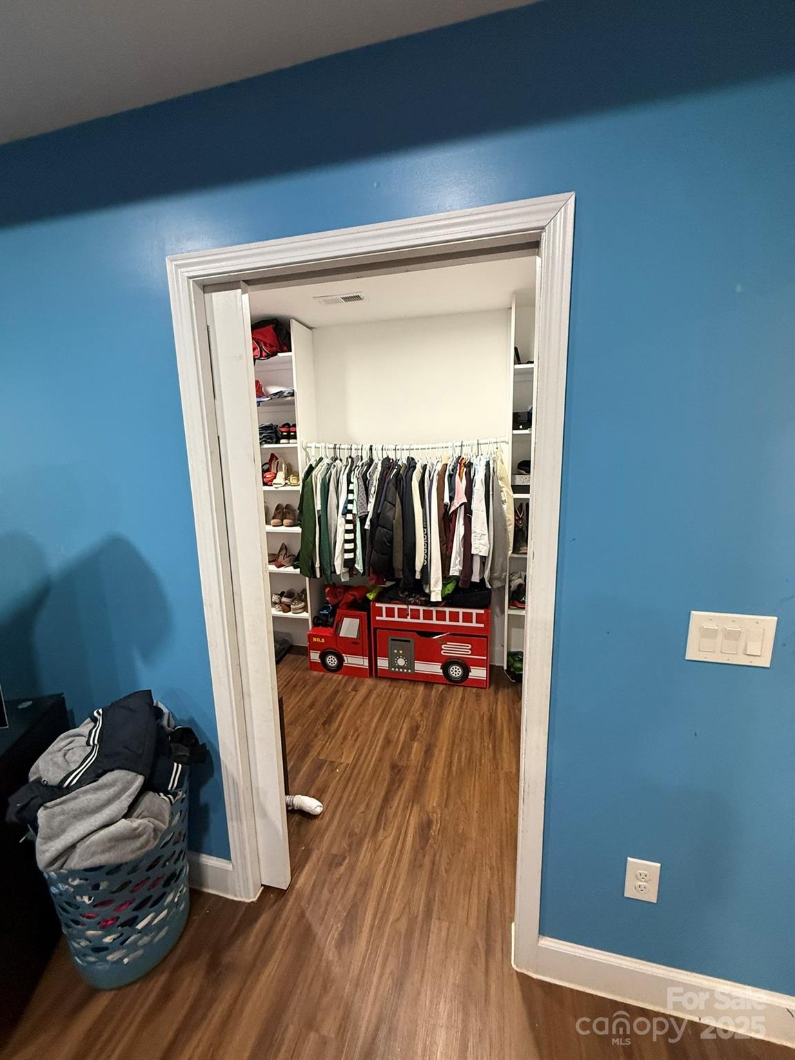 10116 Robert Bost Road Midland, NC 28107 - Photo 18 of 32 a view of a livingroom with wooden floor and a ceiling fan