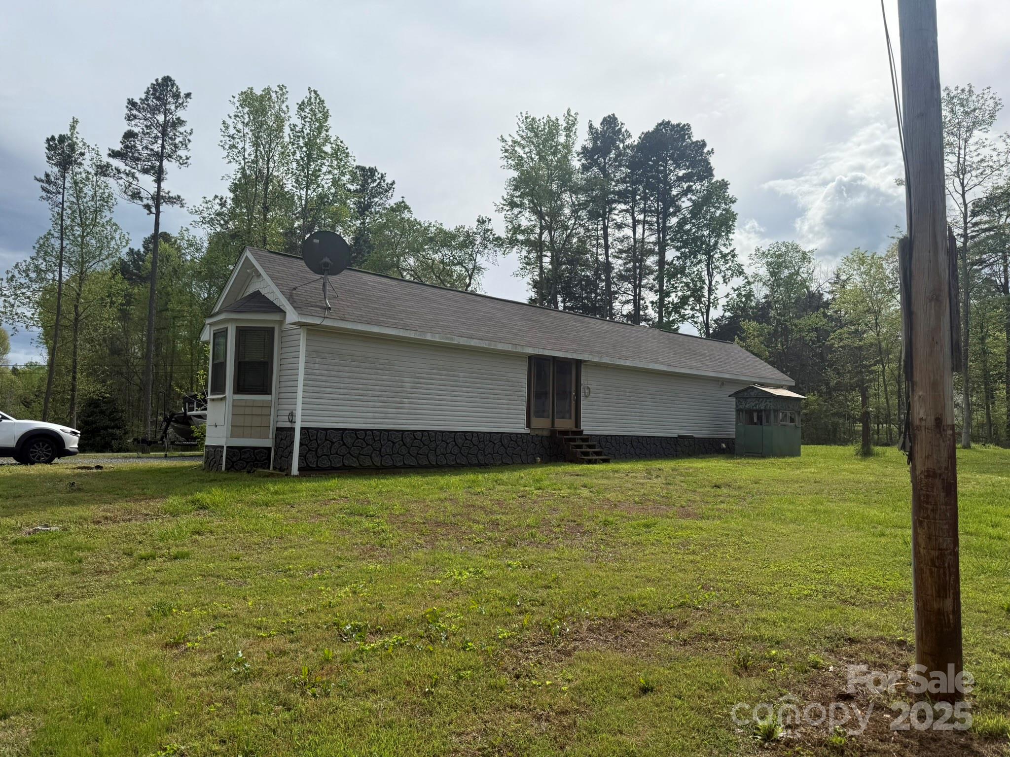 10116 Robert Bost Road Midland, NC 28107 - Photo 24 of 32 a view of a house with a backyard