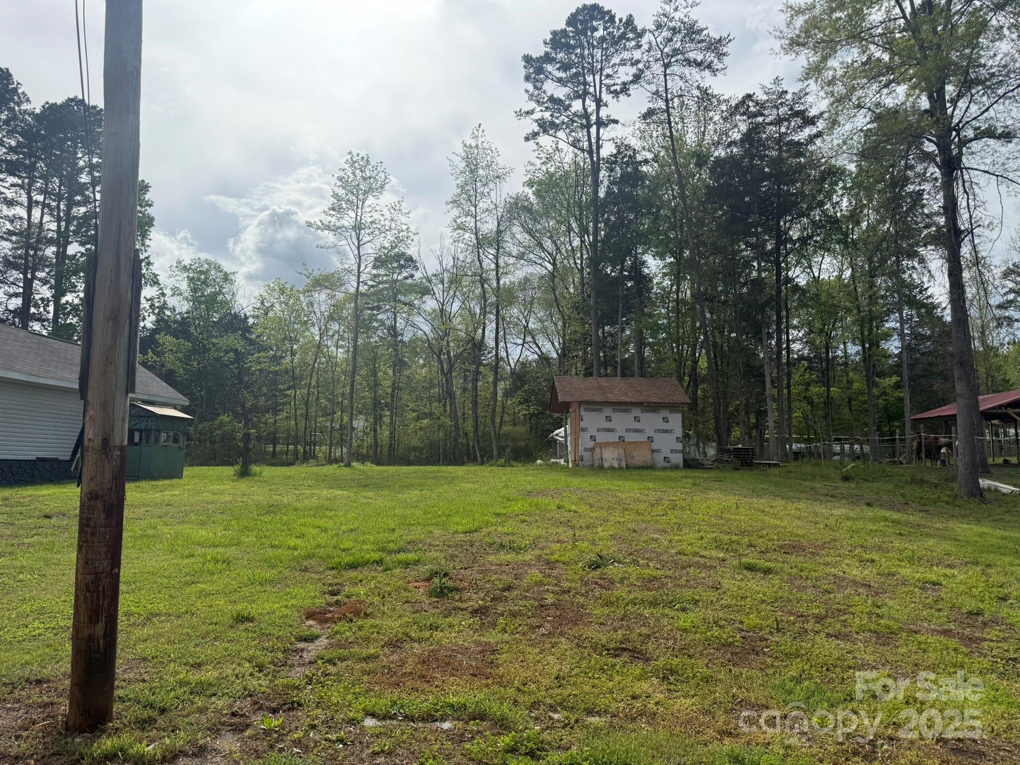 10116 Robert Bost Road Midland, NC 28107 - Photo 25 of 32 a view of a field with a tree