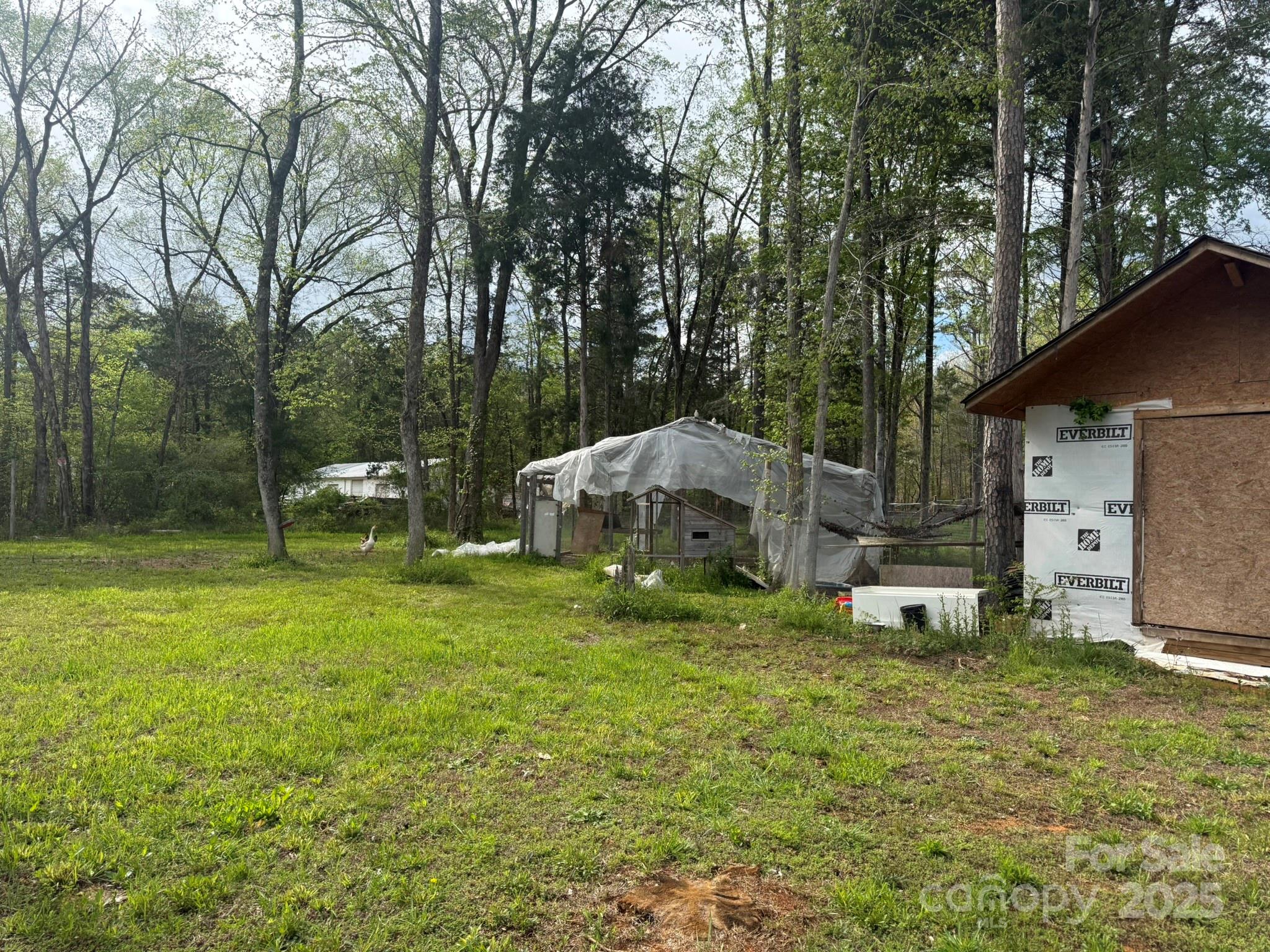 10116 Robert Bost Road Midland, NC 28107 - Photo 27 of 32 a view of a house with backyard and a tree
