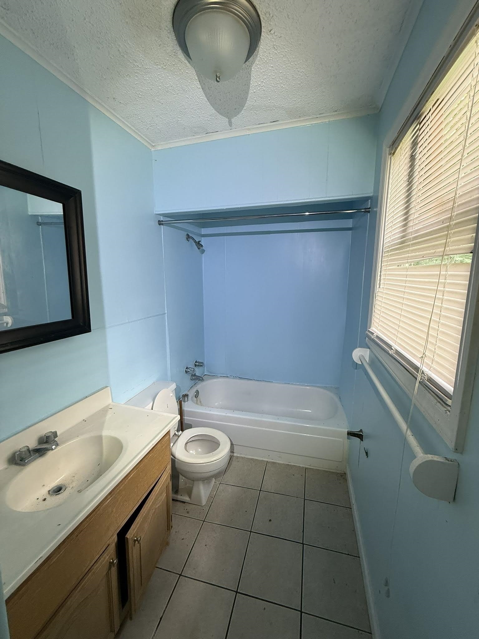 1299 Locke Cuba Road Millington, TN 38053 - Photo 22 of 28 Bathroom featuring a full bathtub with shower surround, a single vanity with storage, and a mirrored medicine cabinet