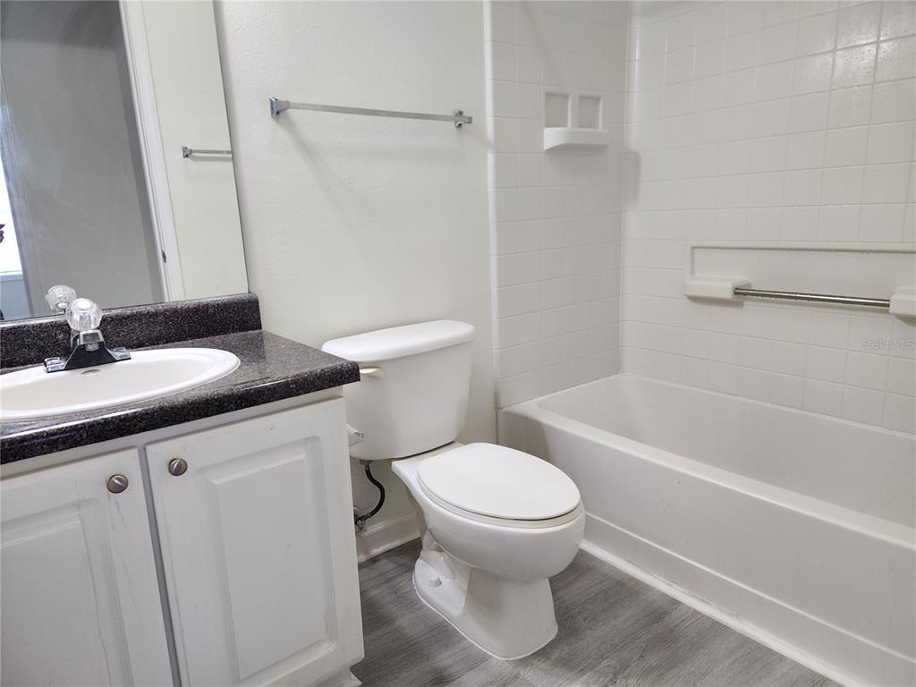 4802 51st Street West, Unit 1418 Bradenton, FL 34210 - Photo 11 of 20 a bathroom with a sink toilet and shower