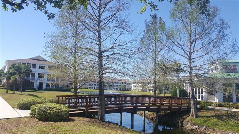 4802 51st Street West, Unit 1418 Bradenton, FL 34210 - Photo 18 of 20 a view of outdoor space with seating area