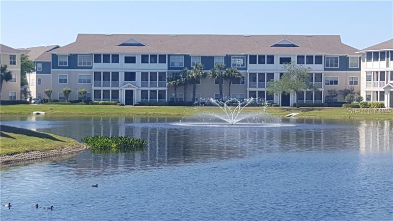 4802 51st Street West, Unit 1418 Bradenton, FL 34210 - Photo 2 of 20 a view of a big yard next to a building