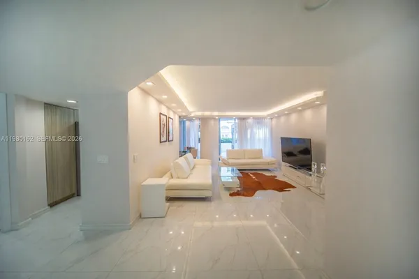 a view of livingroom with furniture and window