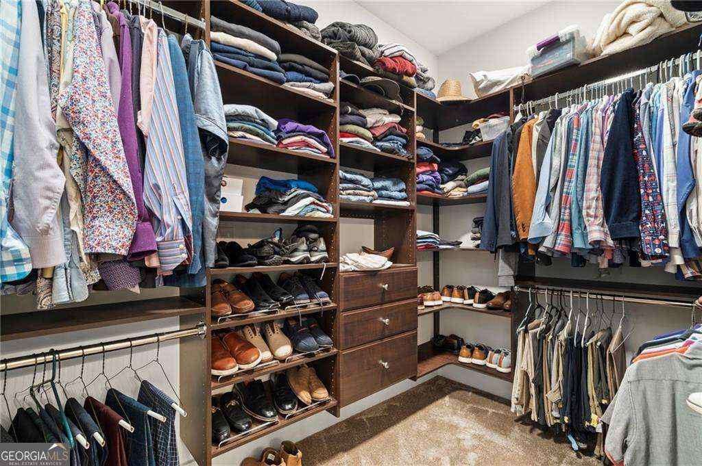 175 STONELEDGE Trace North Jasper, GA 30143 - Photo 13 of 31 a view of walk in closet with clothes and shoes