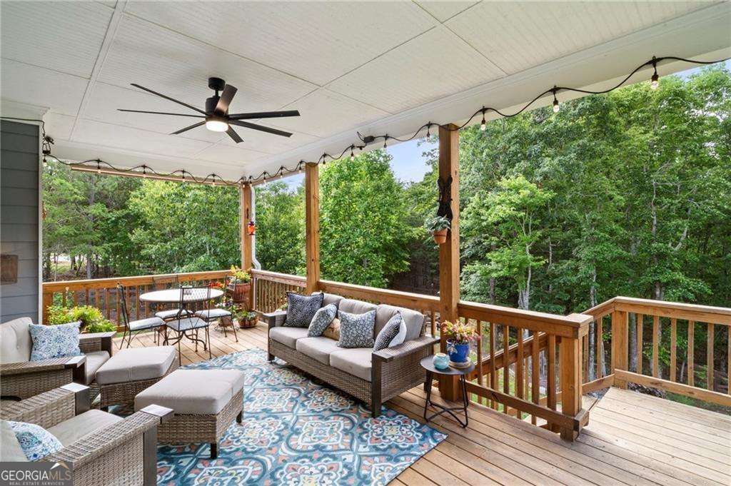 175 STONELEDGE Trace North Jasper, GA 30143 - Photo 18 of 31 a balcony with wooden floor and outdoor seating
