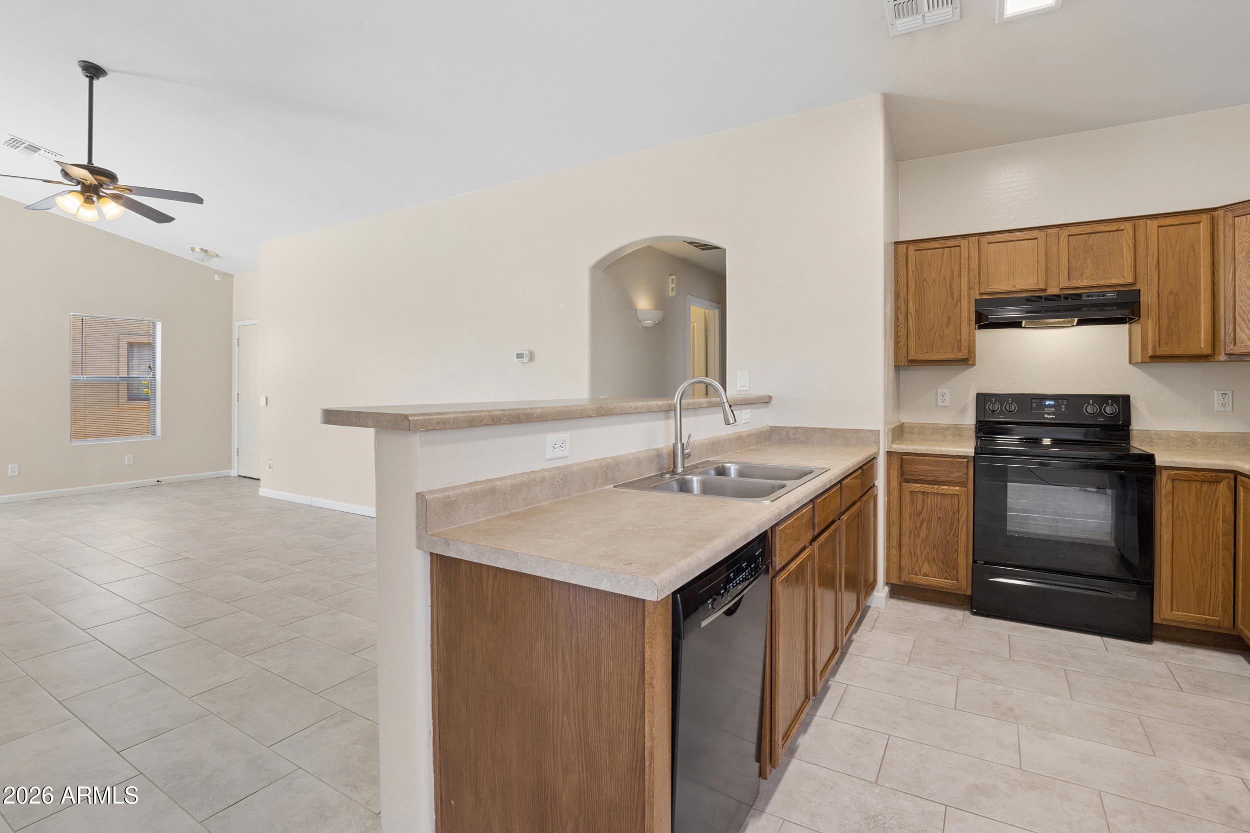 24025 West Pecan Road Buckeye, AZ 85326 - Photo 13 of 42 Kitchen looking towards Hall