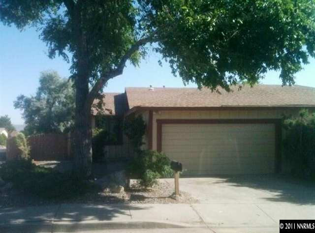 6415 Dandelion Street Reno, NV 89506 - Photo 1 of 13 a front view of a house with garden