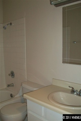 6415 Dandelion Street Reno, NV 89506 - Photo 10 of 13 a bathroom with a sink and a toilet