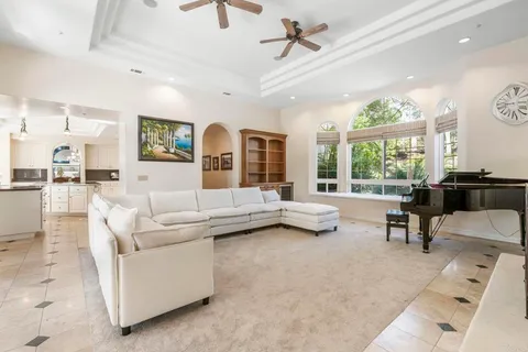 a bedroom with a bed and a ceiling fan