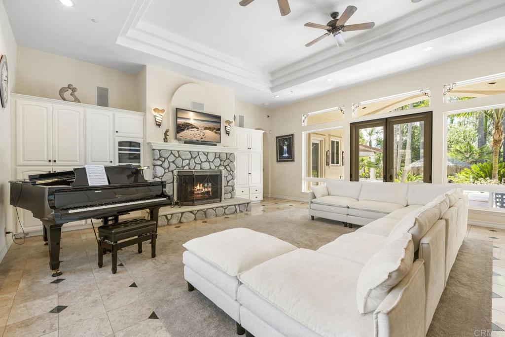 15615 Boulder Ridge Lane Poway, CA 92064 - Photo 17 of 75 a living room with furniture and a fireplace