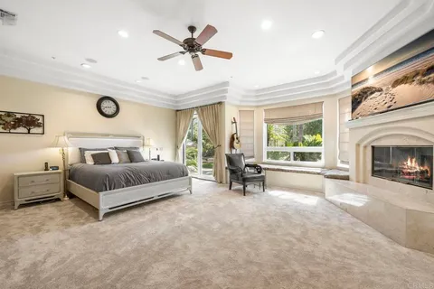 a bathroom with a granite countertop sink a mirror and a shower