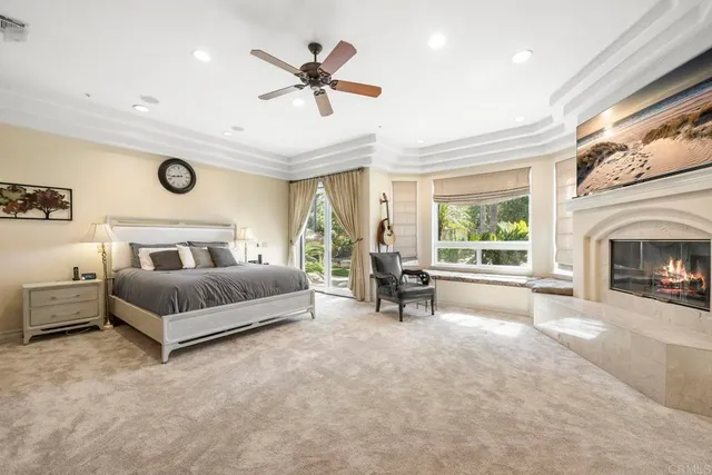 a bathroom with a granite countertop sink a mirror and a shower