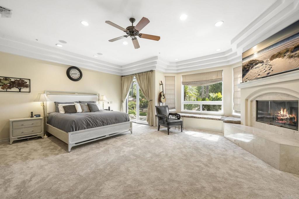 15615 Boulder Ridge Lane Poway, CA 92064 - Photo 18 of 75 a spacious bedroom with a bed and a fireplace