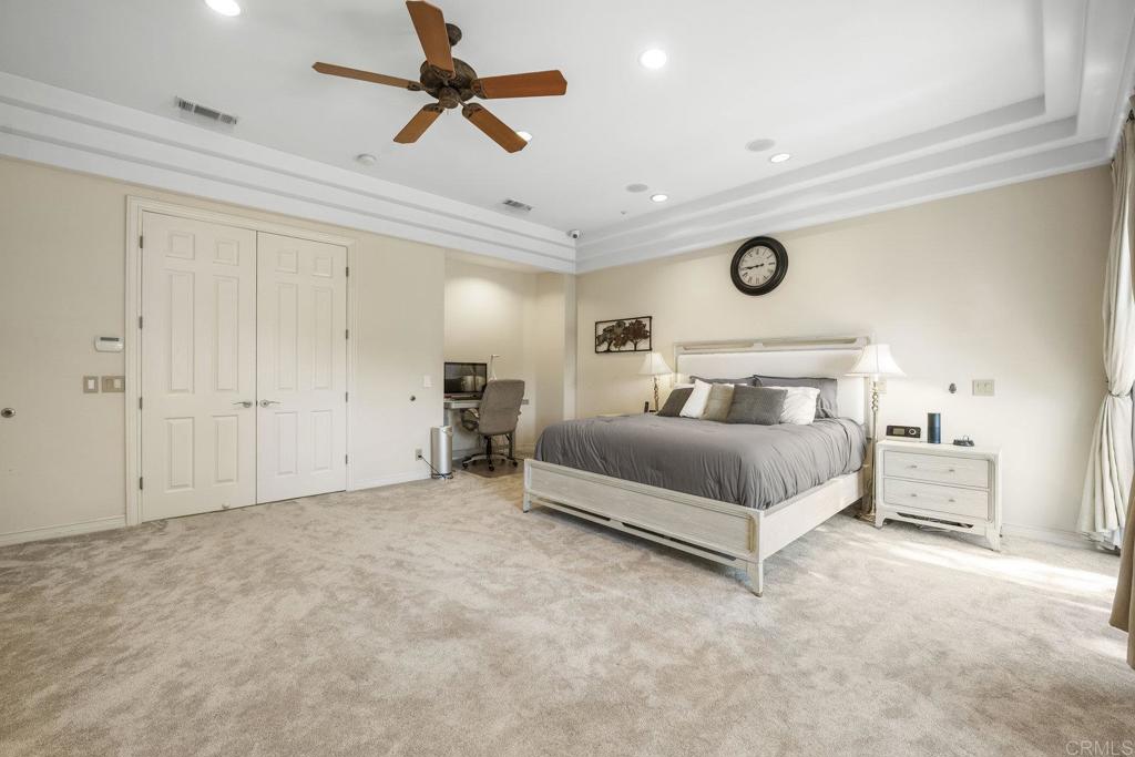 15615 Boulder Ridge Lane Poway, CA 92064 - Photo 20 of 75 a bedroom with a bed and a ceiling fan