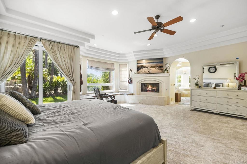 15615 Boulder Ridge Lane Poway, CA 92064 - Photo 21 of 75 a bedroom with a large bed and a large window