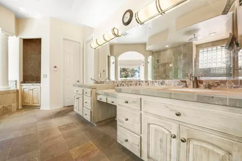 a bedroom with a bed and a book shelf