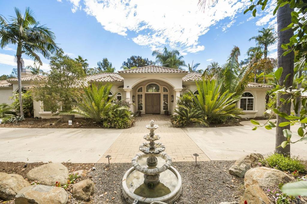 15615 Boulder Ridge Lane Poway, CA 92064 - Photo 3 of 75 a front view of a house with a yard