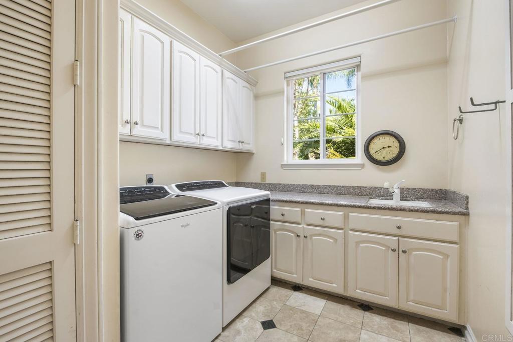 15615 Boulder Ridge Lane Poway, CA 92064 - Photo 31 of 75 a kitchen with granite countertop white cabinets and white appliances